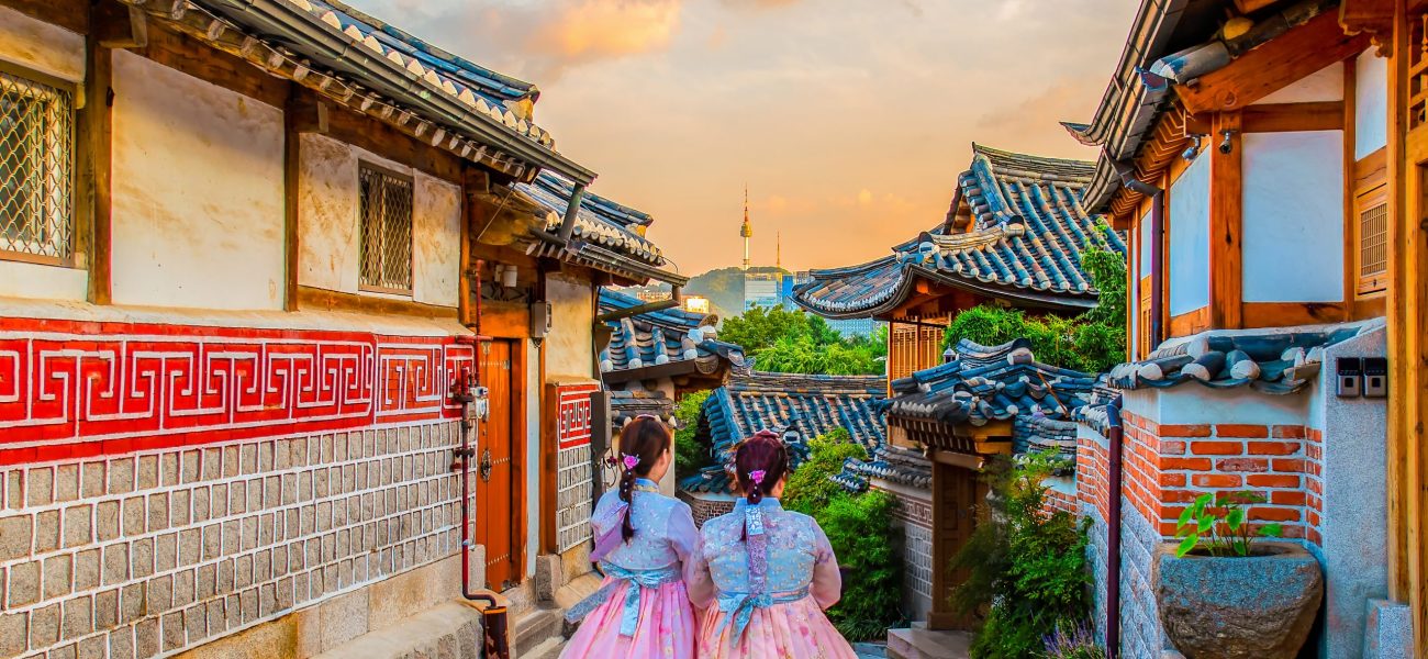 Rear View Of Woman Walking Amidst Buildings Against Sky Photo taken in Seoul, South Korea
